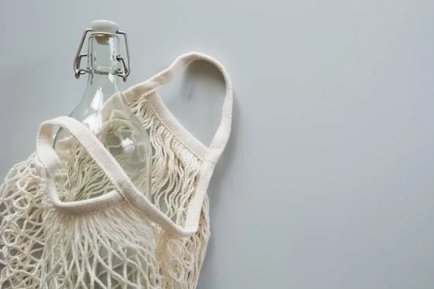 A brightly lit rack displaying clothing from an eco-friendly brand. The clothes are simple, stylish, and made from natural fabrics. The brand's logo is subtly visible in the background.
