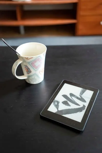 A high-angle shot of a WWD print edition lying on a desk next to a pair of stylish eyeglasses and a cup of coffee, highlighting its role as a daily news source.