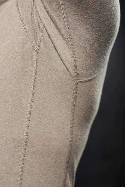 Close-up shot of various athleisure fabrics, showcasing textures and materials like moisture-wicking knits, stretchable blends, and breathable mesh. The fabrics are arranged in a visually appealing manner, highlighting their quality and comfort.