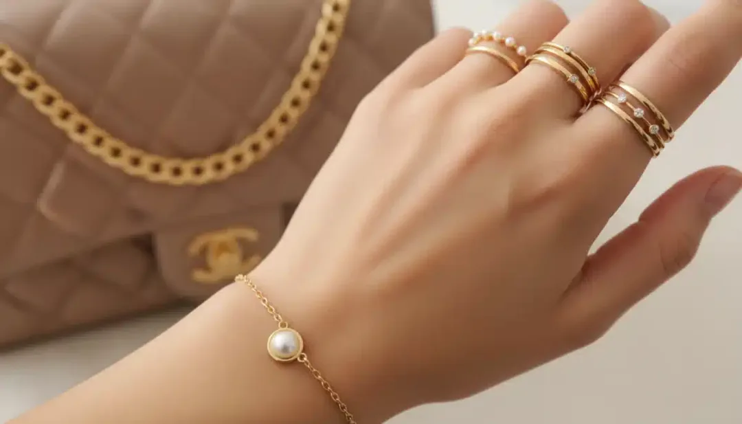 Hand with minimalist rings and an elegant bracelet, showcasing budget jewelry