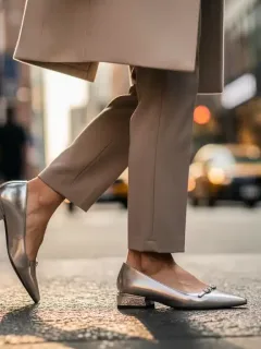 Stylish woman in affordable celebrity-inspired shoes, navigating a city street