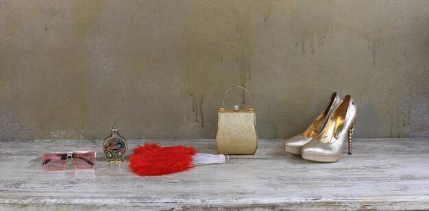 An organized display of affordable red carpet accessories, including high heels, statement jewelry, clutches, and belts, all priced under $50 each. The accessories are arranged to showcase their elegance and versatility.