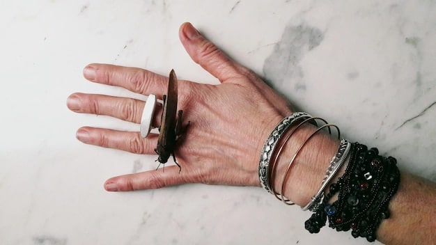 Close-up shot of Rihanna's hands adorned with multiple rings and bracelets, showcasing her unique and eclectic jewelry style.