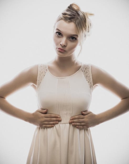 A close-up shot of a celebrity's outfit, highlighting the impeccable tailoring around the shoulders, waist, and hemline. The image should emphasize how a well-fitted garment elevates the overall look.