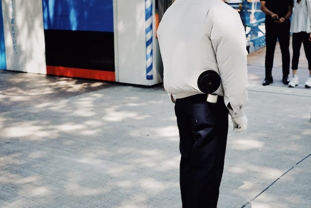 A security guard standing watch at the entrance of a fashion show, symbolizing the importance of security measures in protecting designs from theft.