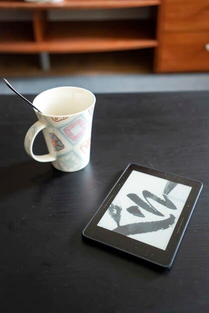 A high-angle shot of a WWD print edition lying on a desk next to a pair of stylish eyeglasses and a cup of coffee, highlighting its role as a daily news source.