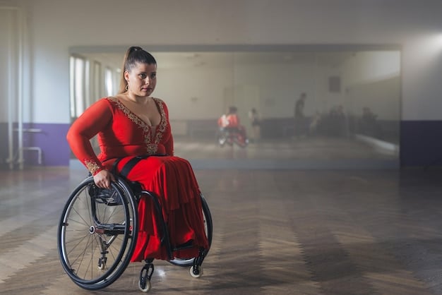 A fashion show model using a wheelchair, confidently posing for photographers at the end of the runway during a US fashion event.