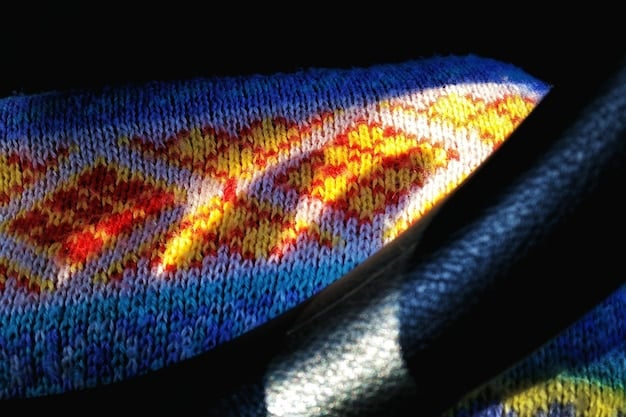 A close-up of a digital display showing AI-generated clothing patterns and designs, highlighting the technological aspect of the design process.