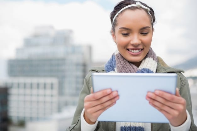 A woman smiling and holding a tablet showcasing the Rent the Runway app, highlighting the ease of browsing and selection available within the application.