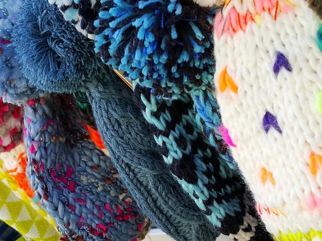 A close-up shot of various fabric swatches showcasing different types of textures and patterns. The patterns include floral, geometric, and abstract designs in a variety of colors, and the textures include velvet, silk, and cotton.