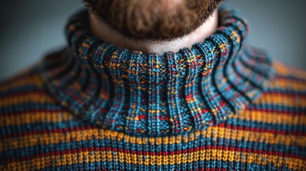 A close-up shot of a layered outfit, featuring a turtleneck sweater, a denim jacket, and a wool coat, showcasing different textures and colors that complement each other.