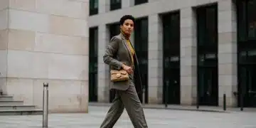 Woman adapting high fashion trends for everyday wear in a city setting